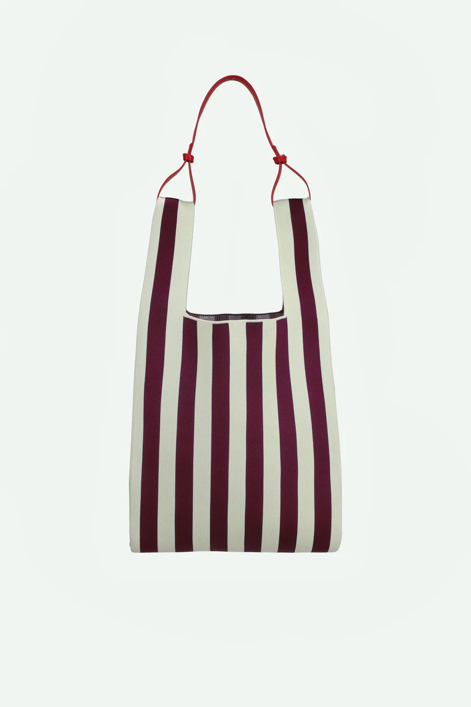 Striped bag with red handle on a white background