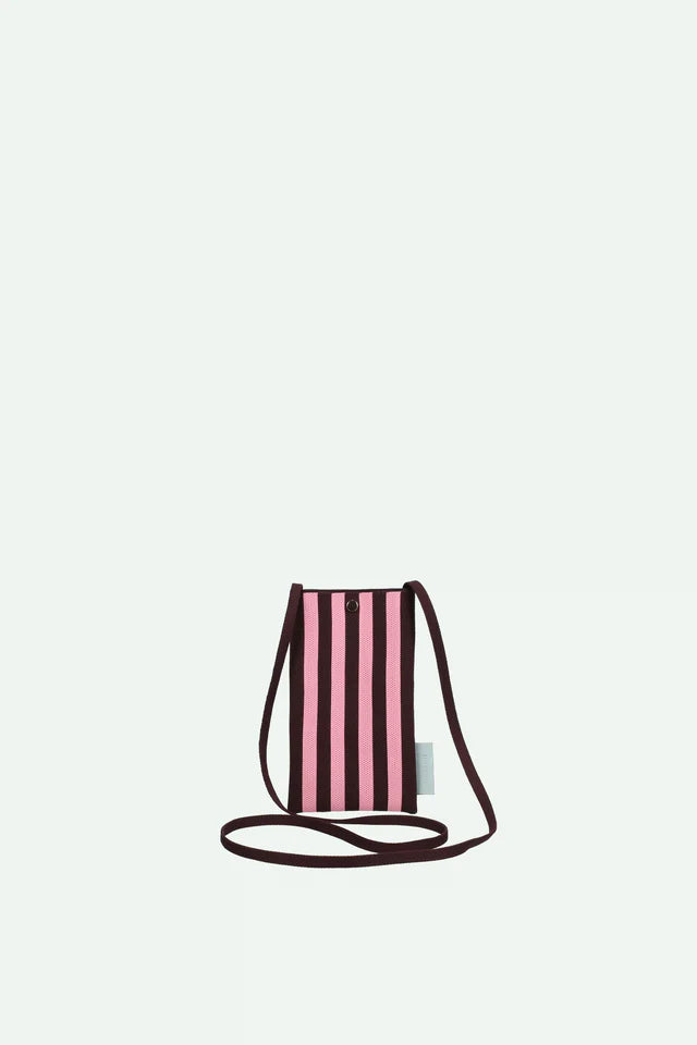 Pink striped crossbody bag on a light gray background