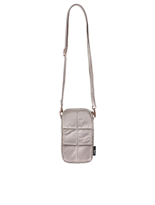 Small beige crossbody bag with a strap on a white background