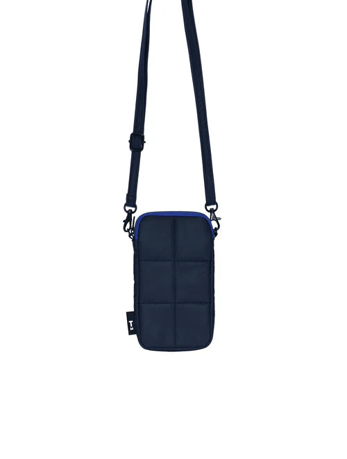 Navy blue crossbody bag with a strap on a white background