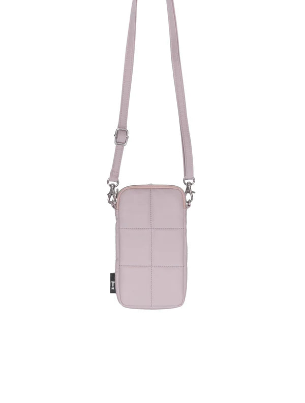 Pink crossbody bag with a strap on a white background