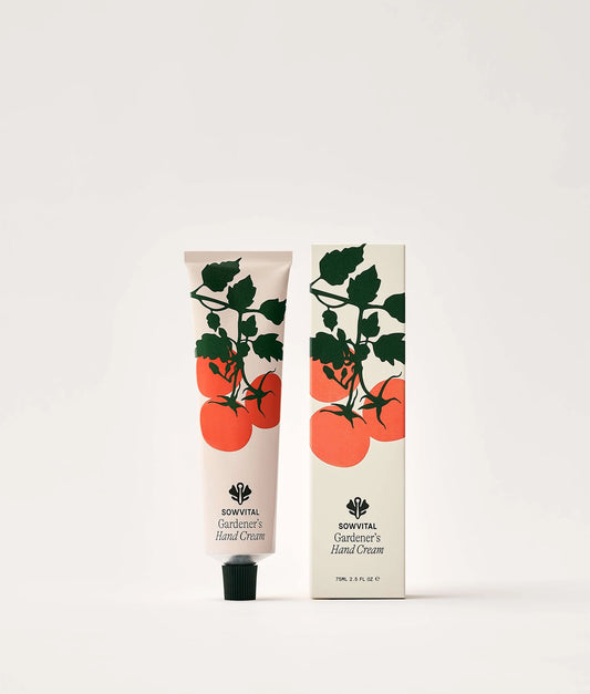 Hand cream tube and packaging with tomato design on a white background