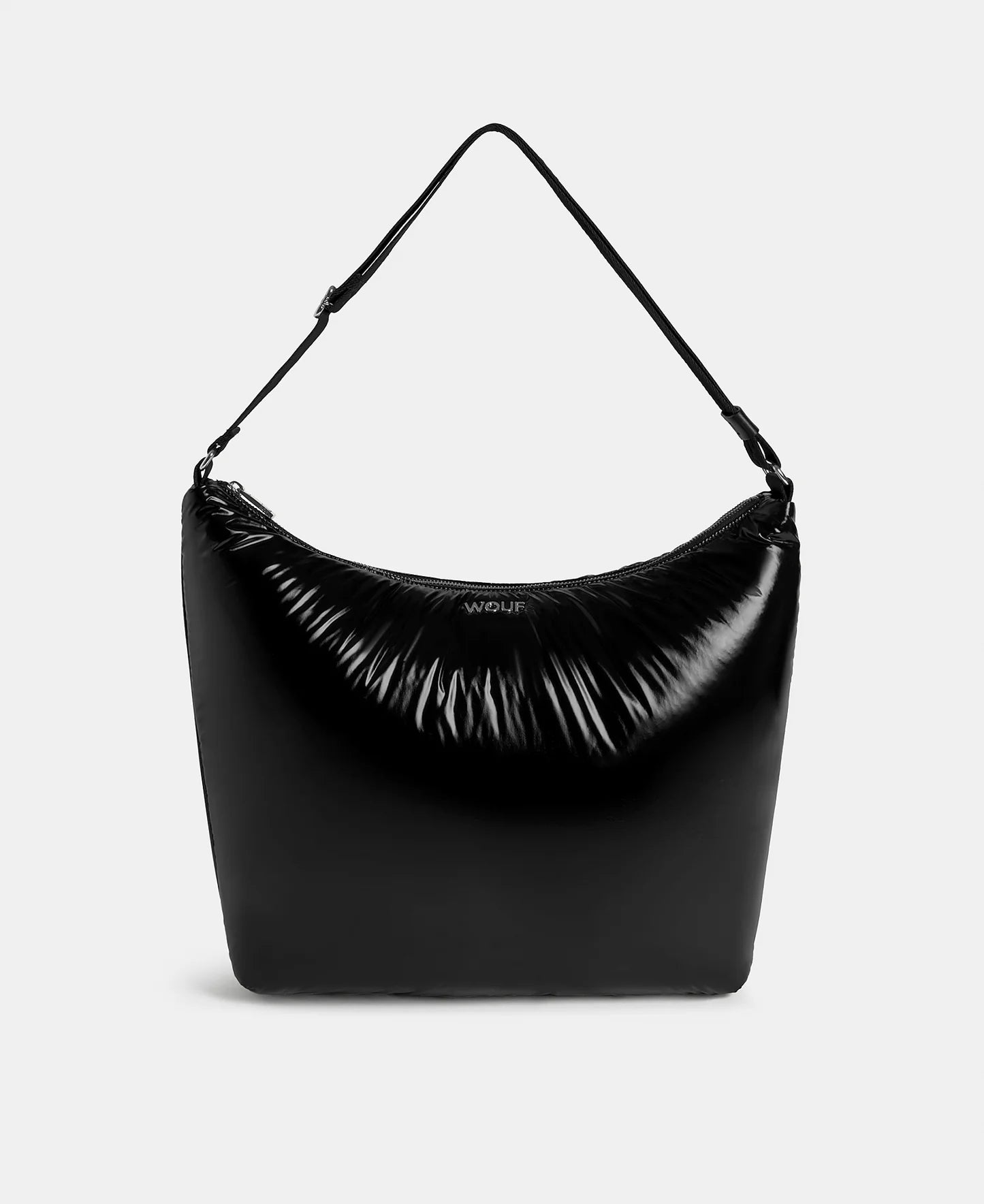 Black handbag with a visible brand logo on a light gray background