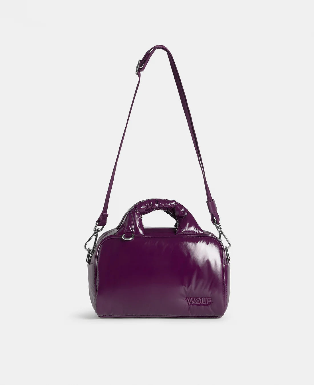 Purple handbag with a visible brand logo on a light gray background