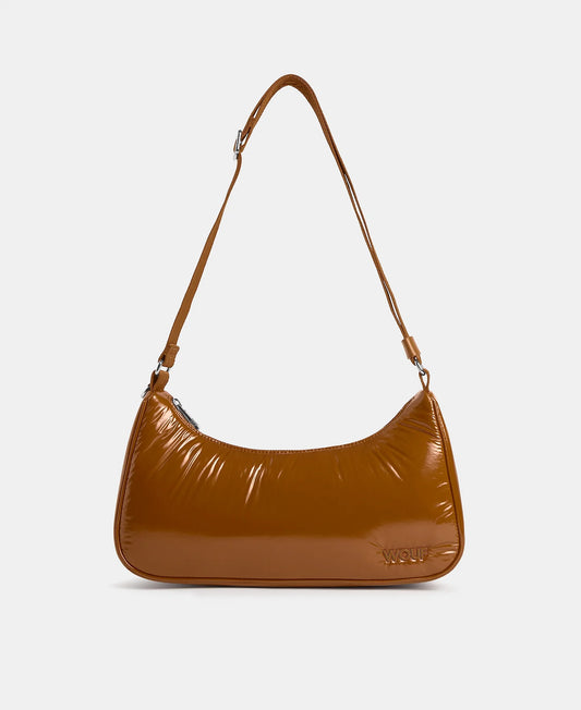 Brown handbag with a shoulder strap on a light gray background
