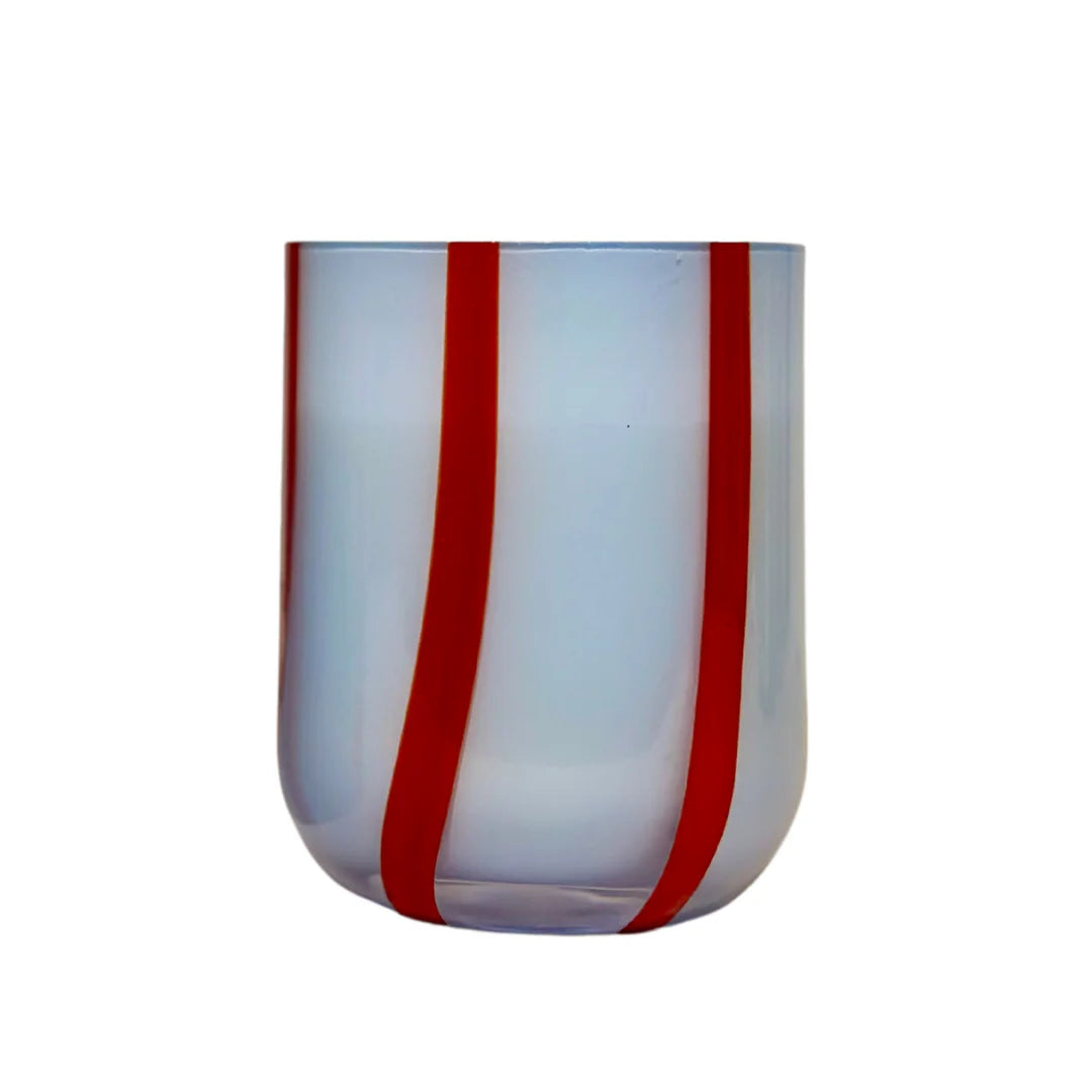 Clear glass tumbler with red stripes on a white background
