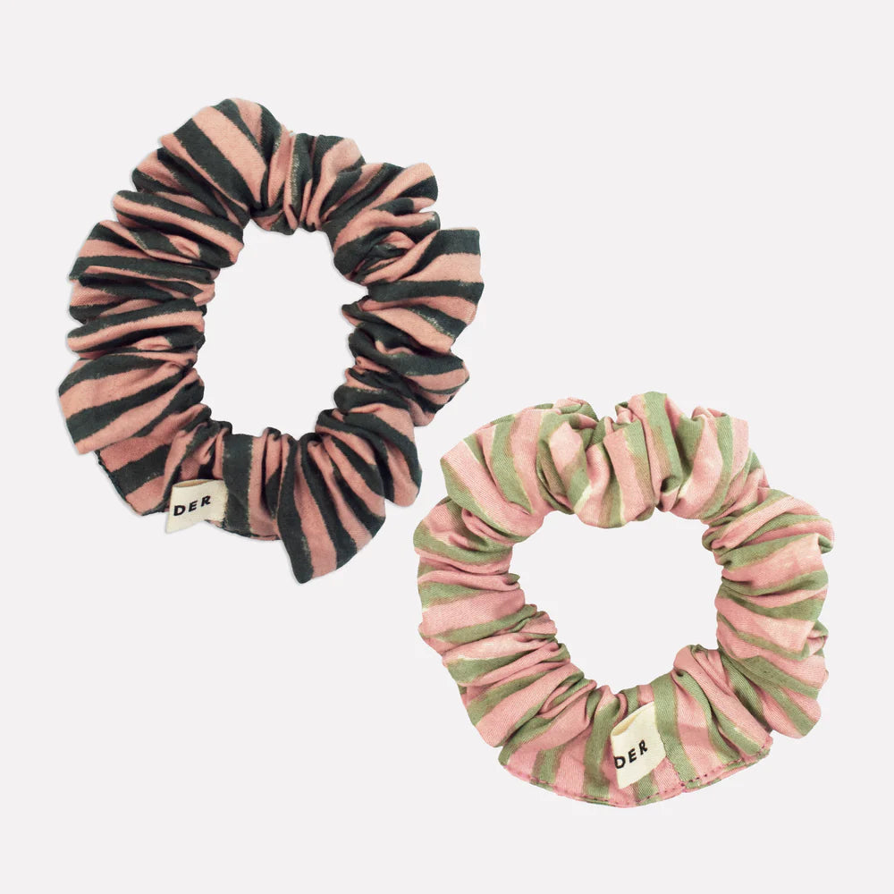 Two striped green and pink scrunchies on a white background