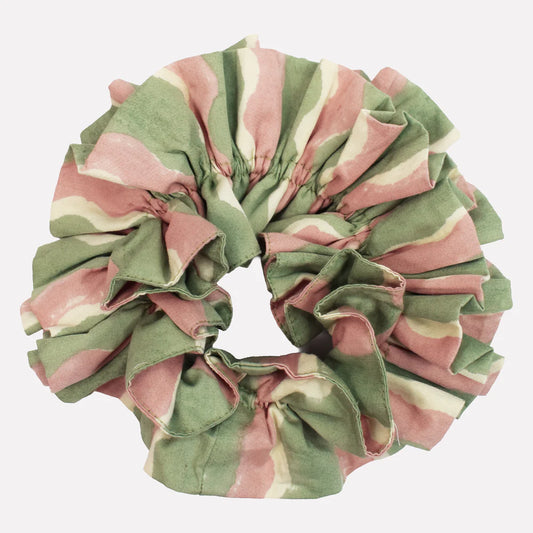 Green and pink striped scrunchie on a white background