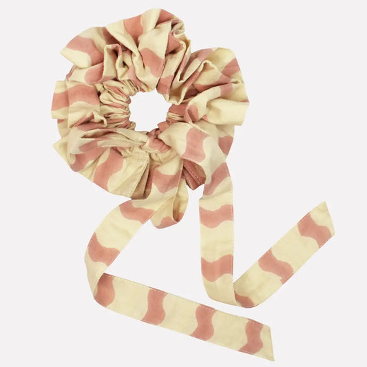Striped scrunchie with a ribbon on a white background