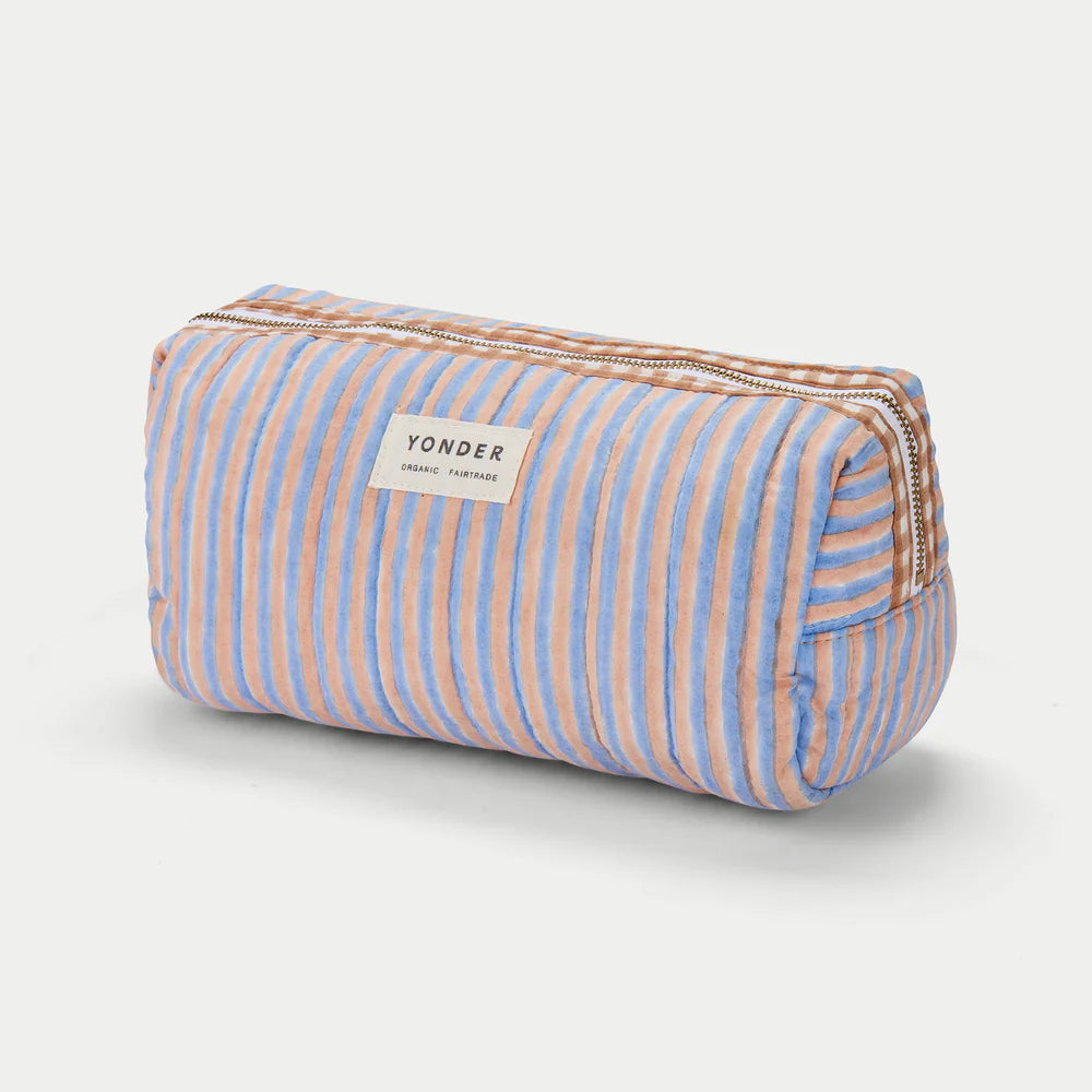 Striped pouch with 'Yonder' label on a light gray background