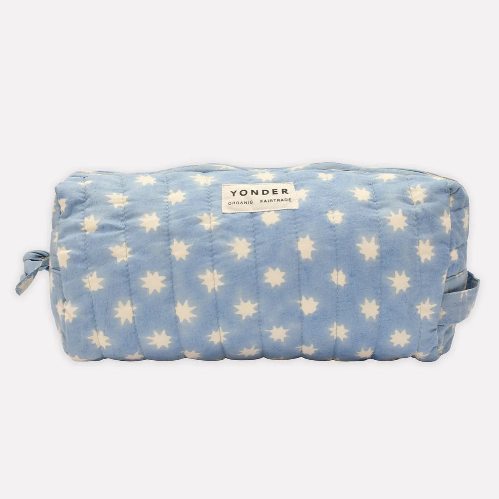 Blue pouch with star pattern and 'Yonder' branding on a white background