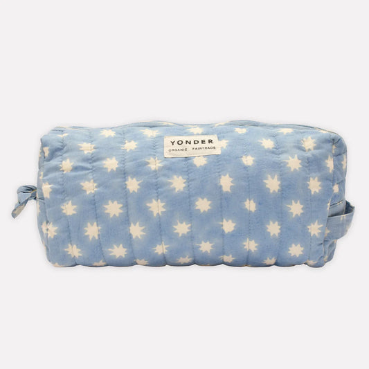 Blue pouch with star pattern and 'Yonder' branding on a white background