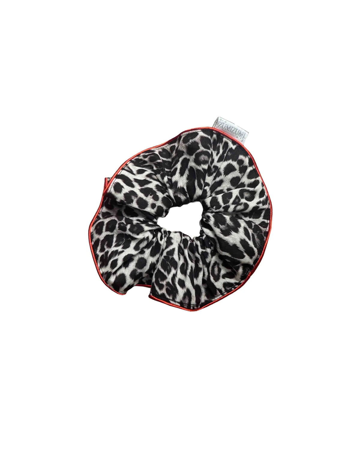 Leopard print scrunchie with red trim on a white background