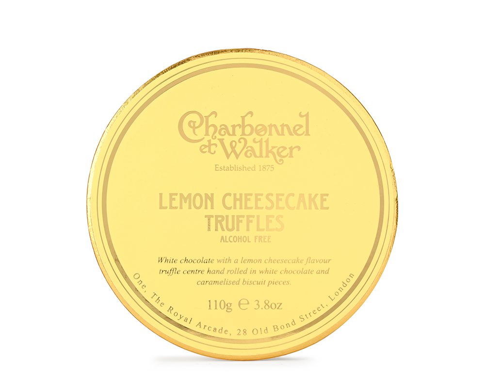 Gold container of Charbonnel et Walker Lemon Cheesecake Truffles on a white background