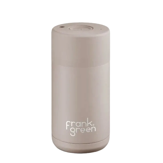A sleek, cylindrical vacuum-insulated travel mug by Frank Green in a matte taupe-beige finish, shown on a clean white background.