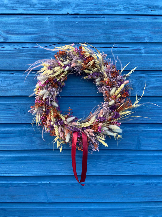 Modern Christmas Dppr Wreath made from purple dry flowers and oats