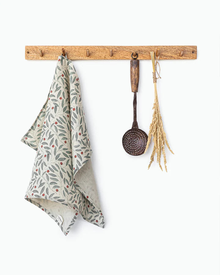magic linen tea towel in mistletoe print 