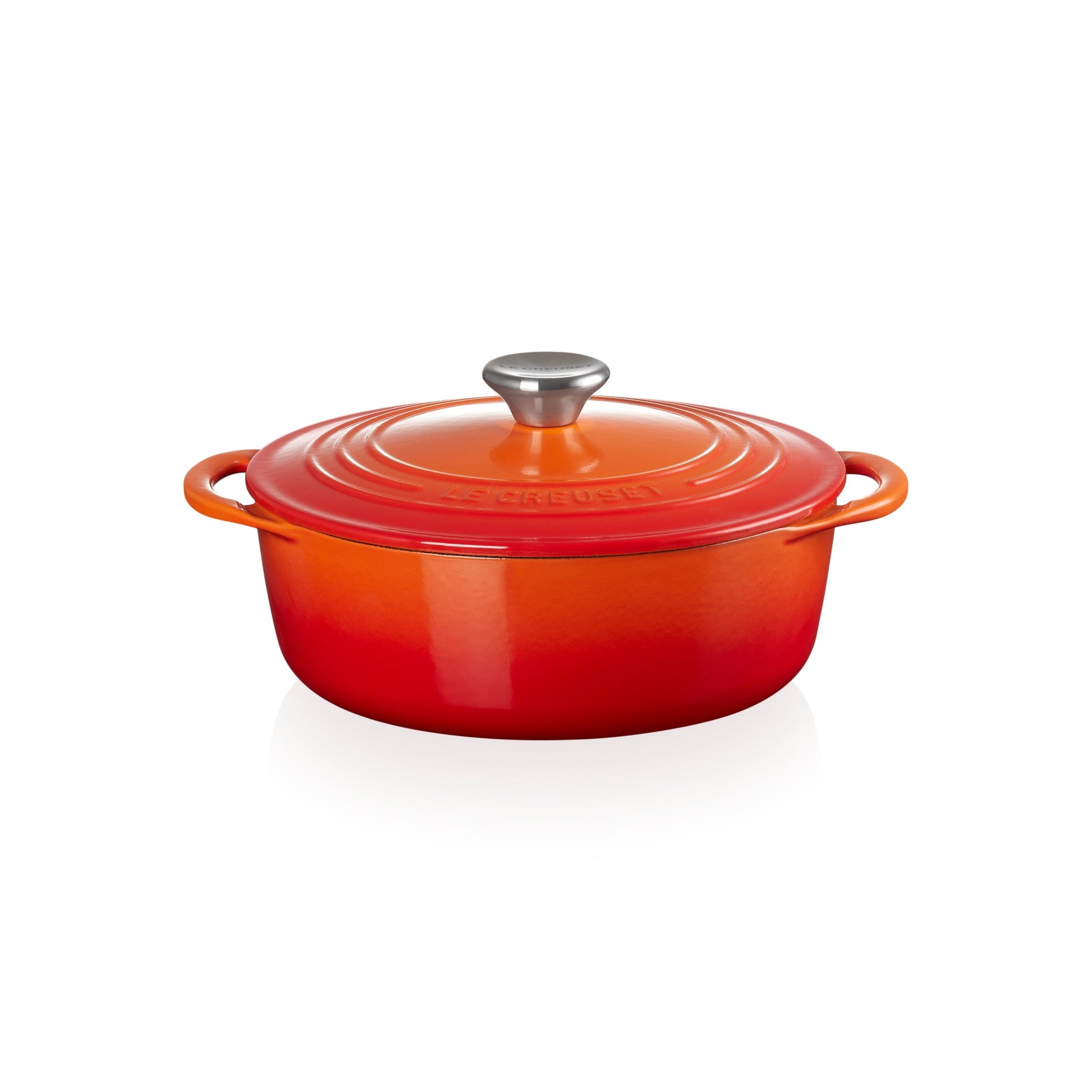 a red and orange ombre casserole dish with matching lid