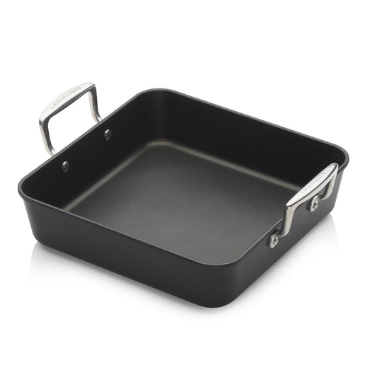 A black pan with two stainless steel handles