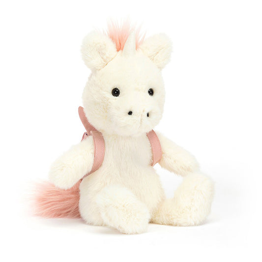 unicorn soft toy with a little pink backpack