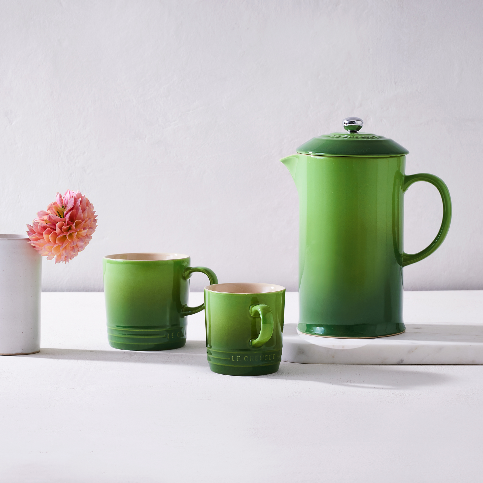 the mug show with it's larger counterpart and the matching coffee press