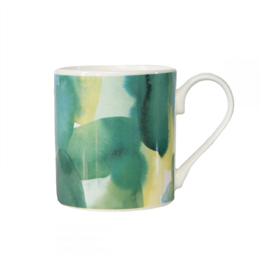 a bone china mug with a green watercolour pattern