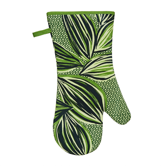 an oven glove with a bold leaf design and green trim