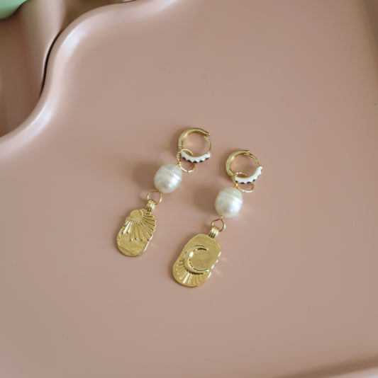 Gold hoop earrings with sun, moon and pearl charms 