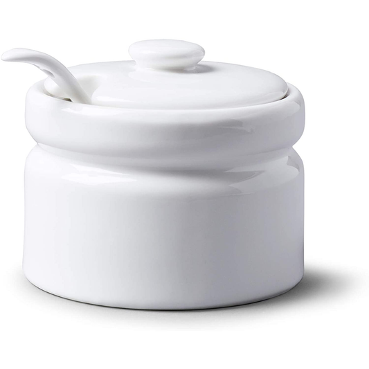 a sugar dish with a lid and spoon