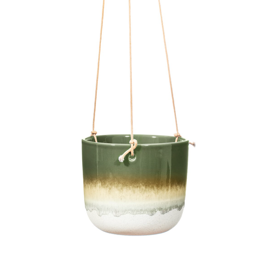An ombre green planter handing from twine string