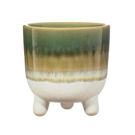 a green and white ombre plant pot with three legs