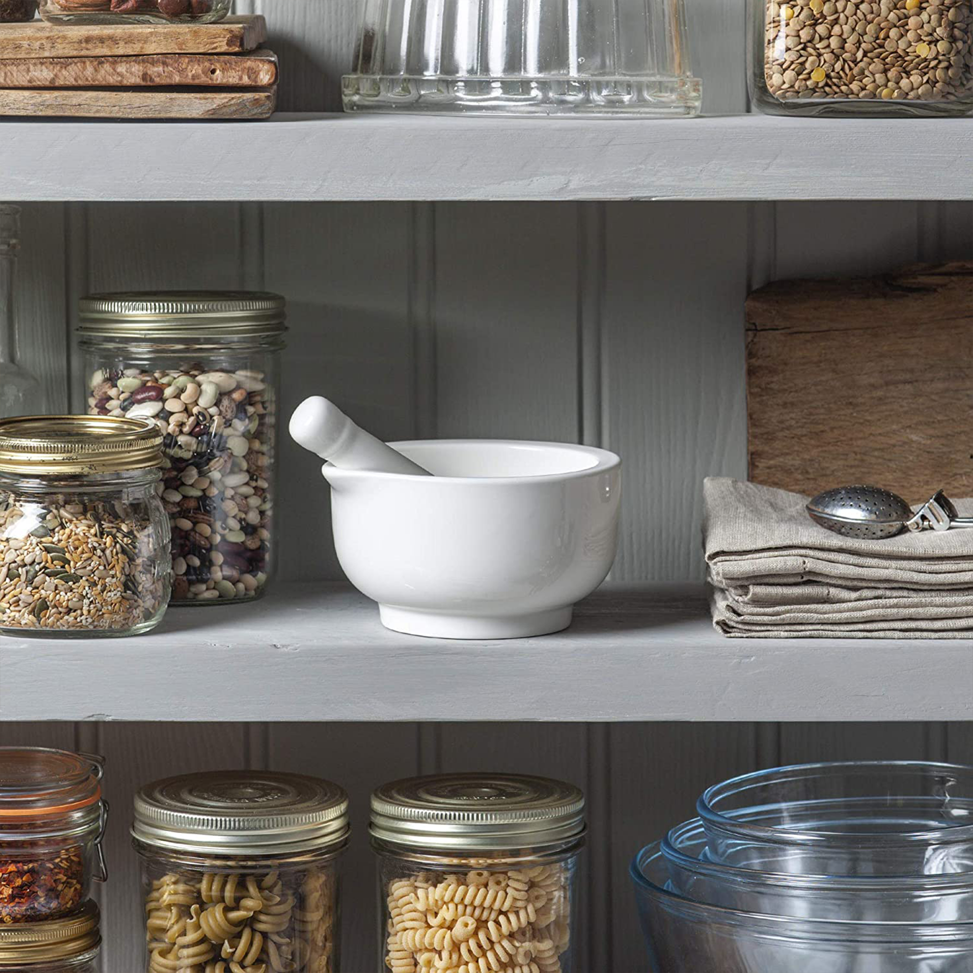 the moratar and pestle on a pantry shelf