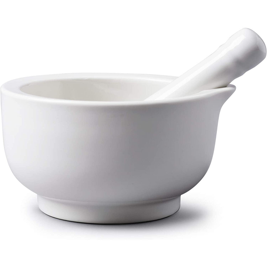 a white morat and pestle with a pouring lip