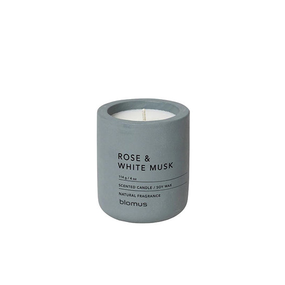 A rose and White Musk candle in a concrete container