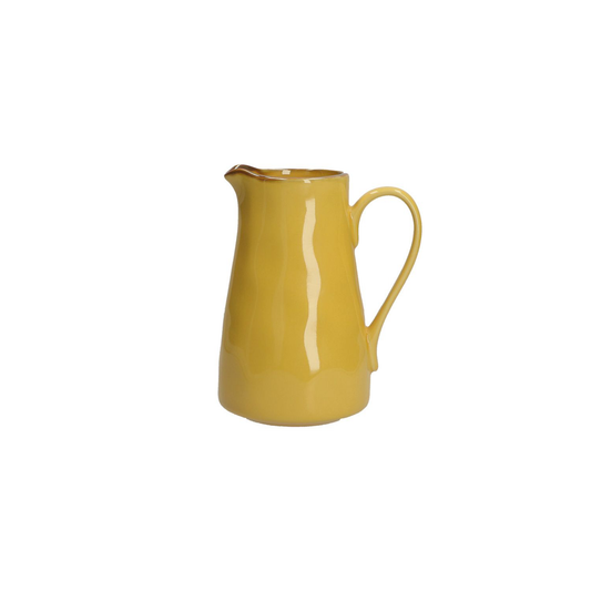 a rustic yellow glazed jug