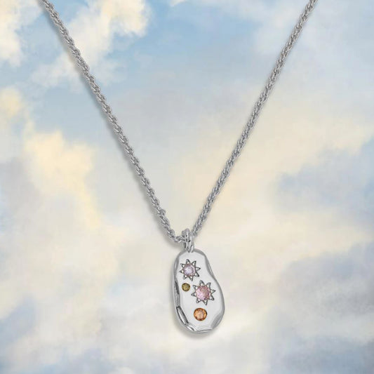 silver pebble style pendant necklace with rope chain and pastel toned cubic zirconia 