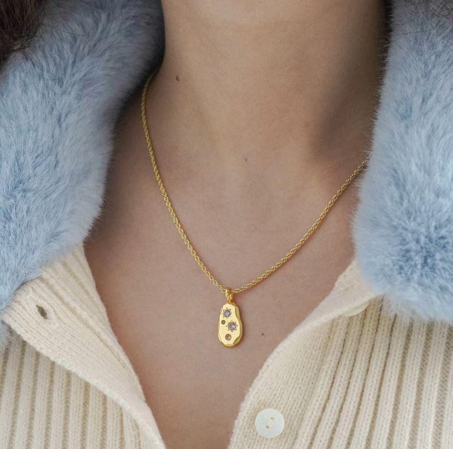 necklace shown on model in gold version 