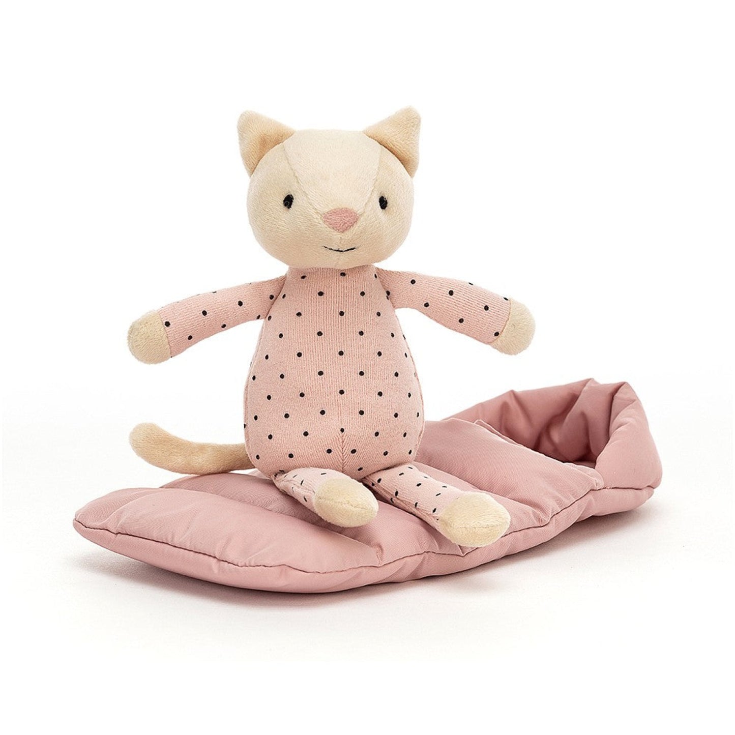 a cat soft toy wearing a pink dotty onsie with a pink sleeping bag