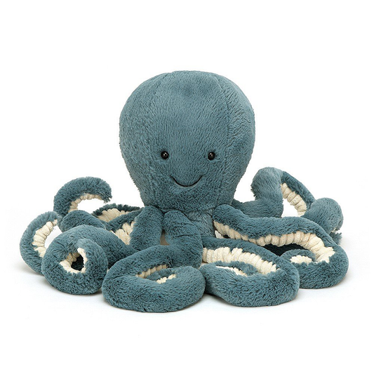 a large blue octopus stuffed animal with a smiley face