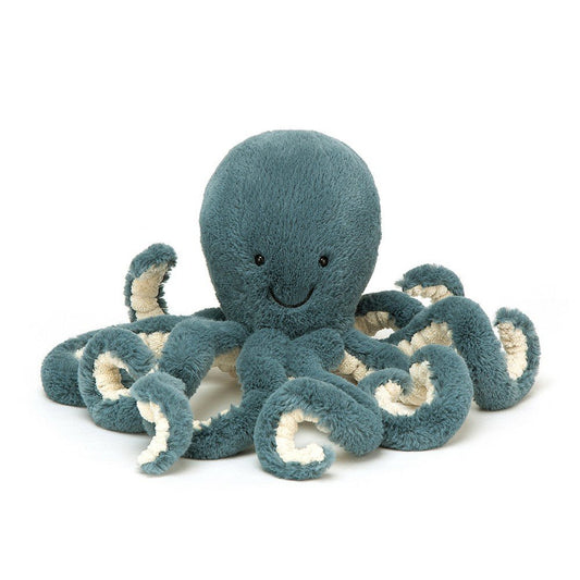 a blue octopus soft toy with curly tentacles and a smiley face