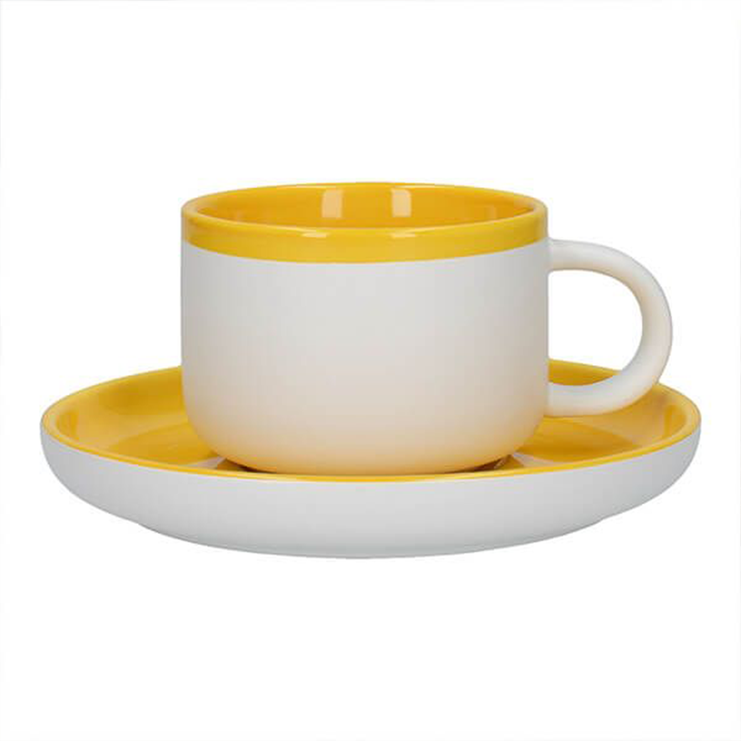 a white tea cup with a yellow rim and interior sat atop a saucer with a yellow top and white bottom