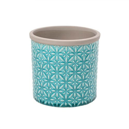 A bright blue patterned stoneware plant pot with a grey interior