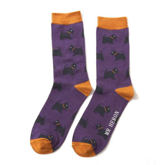 a pair of purple and orange socks with black west highland terriers on them